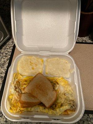 Bacon, eggs, And cheese omelet with grits n toast