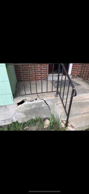 Damaged front patio we replaced in the next photo