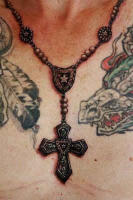 Realistic rosary tattoo