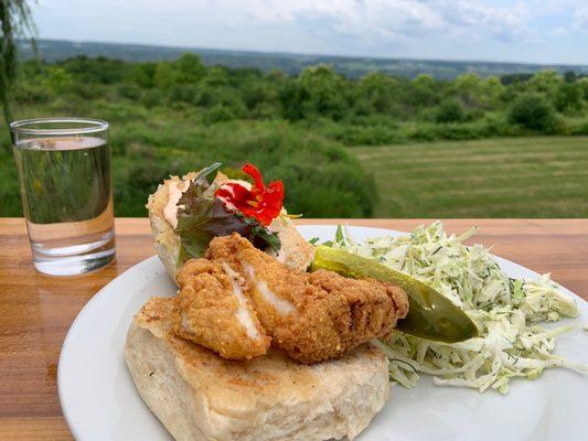 Cornmeal crusted catfish sandwich with an edible flower!