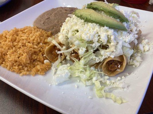 Chicken flautas with rice and beans.