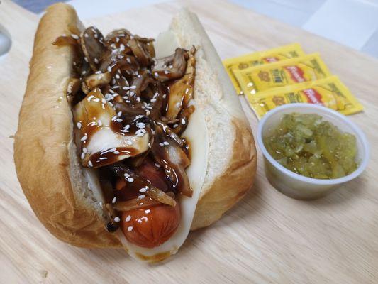 Teriyaki Terrier Dog with Teriyaki Sauce, Grilled Onions, Mushrooms, Sesame Seeds, and Provolone Cheese.