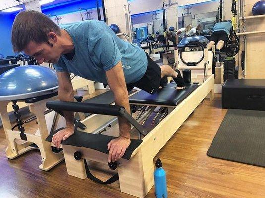 Owner, Joe planking on the reformer!