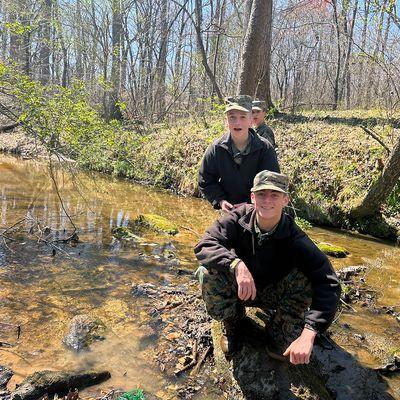 Students visit a local creek to collect samples for an earth sciences class