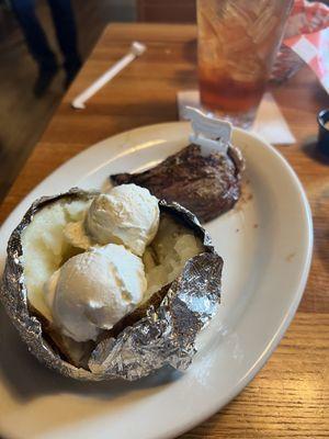 Steak and potato with Sweetened Ice Tea