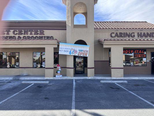 Front View of Building: Side by side Paws and Whiskers Pet Shop next door to Caring Hands Animal Hospital. New Puppy Store in Las Vegas