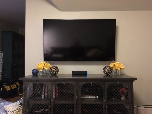 50" TV mounted on wall w/ wiring concealed