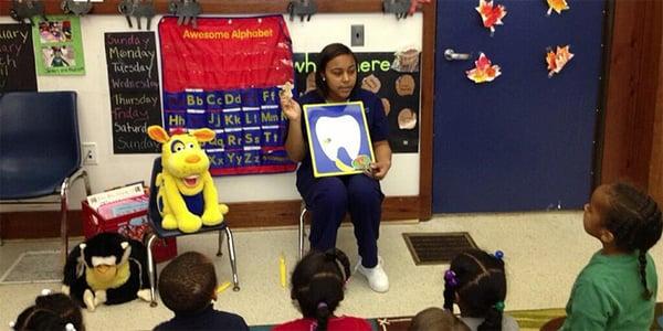 Andrea teaching the children the importance of their oral hygiene.