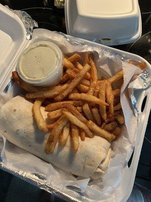 Buffalo chicken wrap with fries to go.