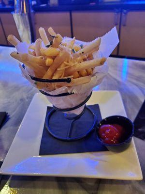 $8-9 truffle fries, can't taste any truffles. So $30 for 1 ok drink and fries, gratuity was automatically included on bill