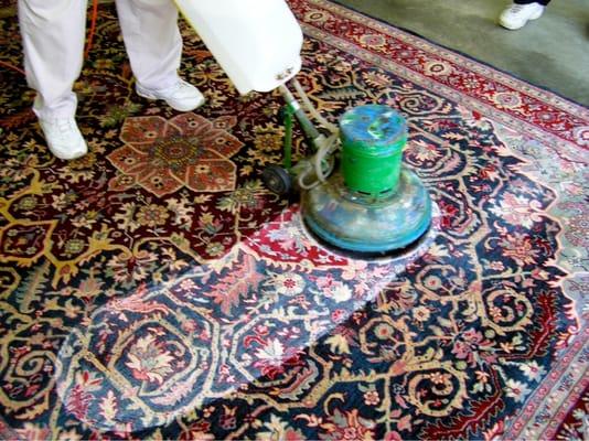 The starting process of cleaning an oriental rug in the shop