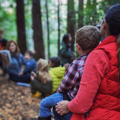 Story time in the ravine at our schoolhouse.