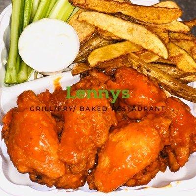 Buffalo wings with wedges, celery sticks and blue cheese