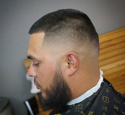 Skin fade with beard line up and trim