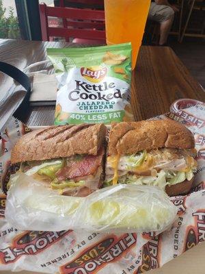 Turkey bacon ranch on wheat medium sub with chips and pickle