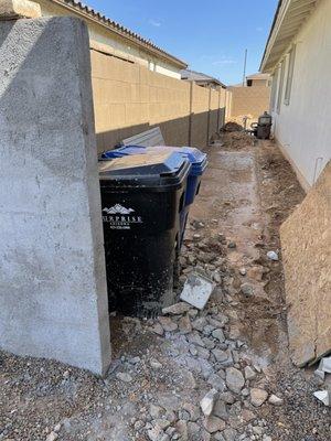 Cement splattered everywhere just goes to show the quality of their work. Couldn't even move the bins out the way