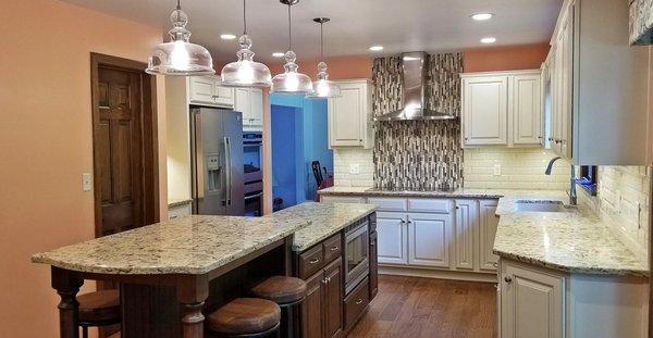 Check out this beautiful two tone kitchen renovation by McLusky Showcase Kitchens & Baths! Kitchen features large island.