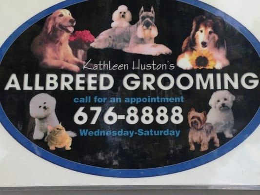 A sign on the front door for Kathleen's special grooming