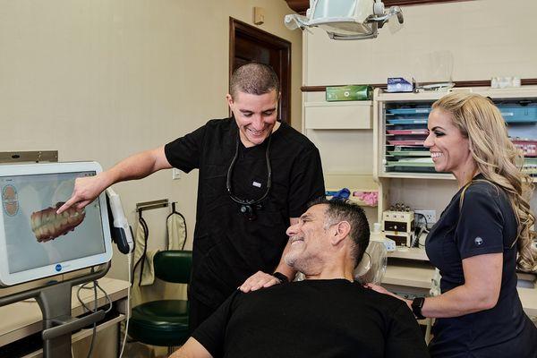 Miami dentist Dr Gio Gonzalez explaining dental crown options at Flossy Smiles