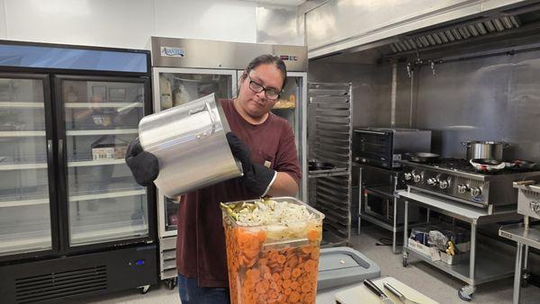 Chef Bear making a huge batch of Housemade Pickled Carrots.