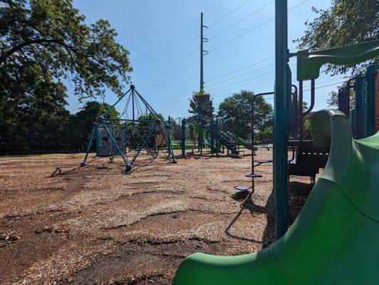 Playground with toddler and older kid play and swings with parking at Waffle House