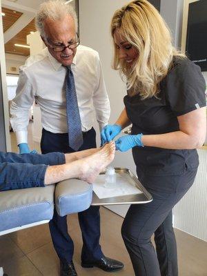 Dr Roth and his assistant Wendi Perform a Foot inspection