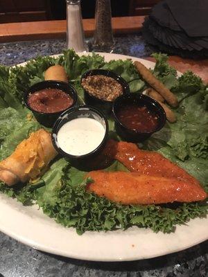 Appetizer sampler plate. Half eaten! The mini chimis were the best!