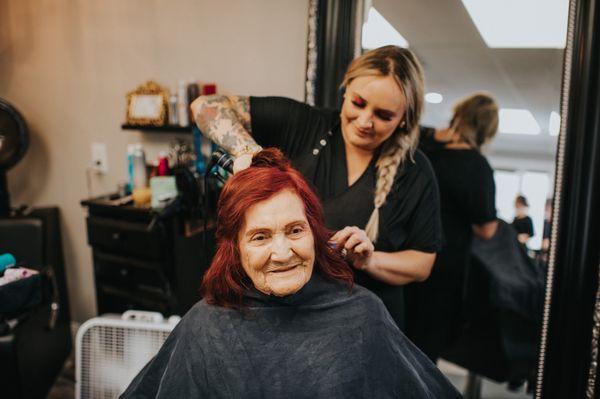 The owner Vanessa doing my grandmother's hair the day of our wedding.