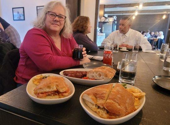 Kristy looks over the chorizo sampler, along with solomo and pork belly sandwiches.