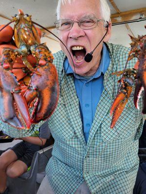 Our tour guide having fun with a few live lobsters which were returned to the ocean