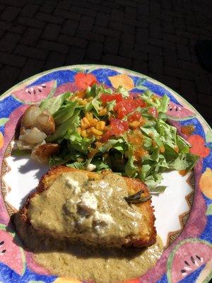 Corn pudding with mixed greens