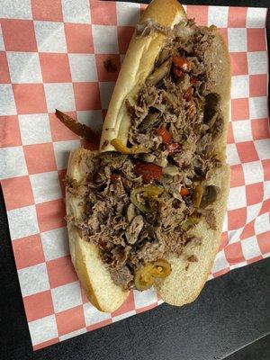 Medium cheesesteak with peppers and mushrooms.