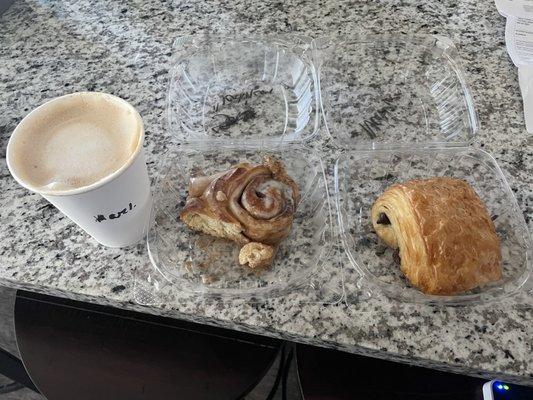 Latte, cinnamon roll, chocolate croissant