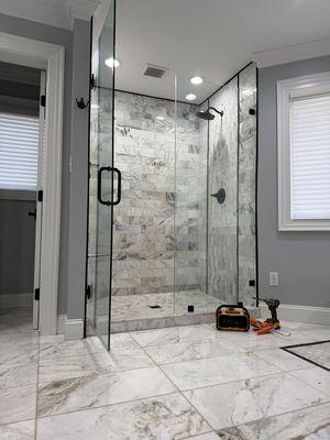 Marble tile shower custom sloped basin