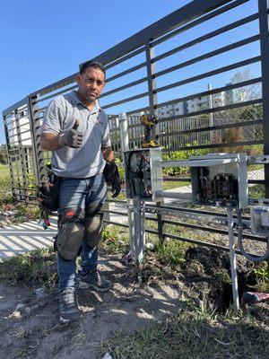 electrical service installation, feeder, meter, panel, branch circuits in a metal rack.