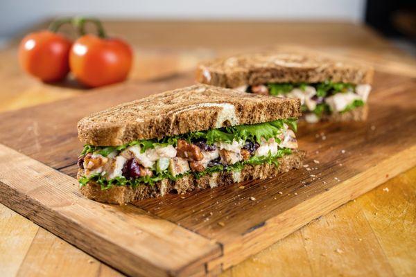 LOADED CHICKEN SALAD: Chopped chicken, glazed pecans, dried cranberries, celery, olive oil mayonnaise and spring mix.