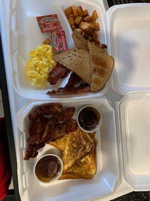 Breakfast to go. French toast. Eggs and bacon.