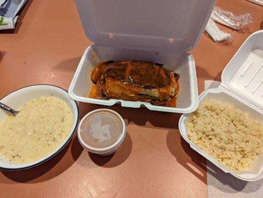 Moussaka with side of rice, tomato sauce and lemon rice soup