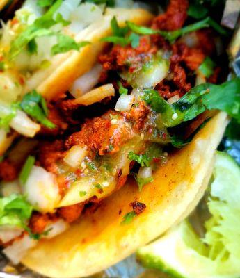 Al Pastor taco with green sauce