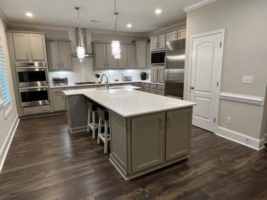 The island was a very dark brown espresso and Carlos matched our existing gray cabinets.  We love it!