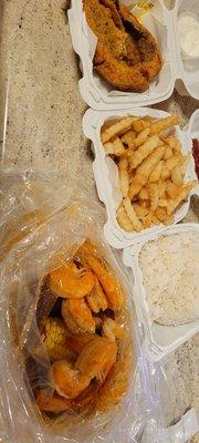 Shrimp boil with special sauce, mild.  Rice French fries Fried whiting with tartar sauce