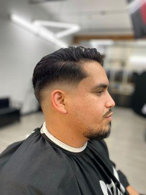 Mid Fade with a side part.