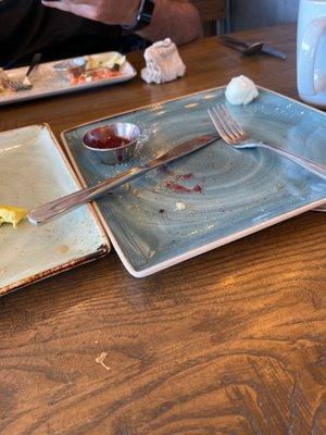 Empty plates mean food is gone. Food gone means full stomach.