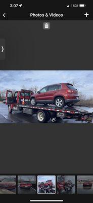 Jose Garcia's tow truck towing a car for me