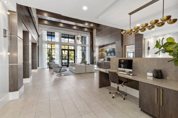 Clubhouse with modern furniture and Apple Computers at Lantower Grande Flats Apartments.