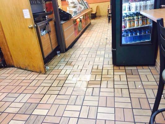 Soda machine leaking water all over the floor, slip and fall and you have a law suit, check out the overflowing garbage bin