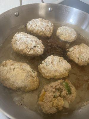 Salmon croquette patties frying