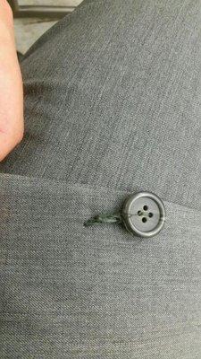 They ripped the button off my husband's suit.