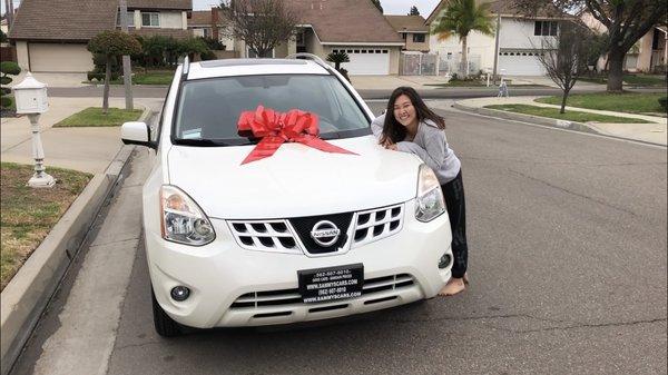 Very happy to receive her new 2012 Rogue SV.