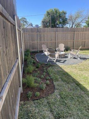 Backyard w/ uber cool firepit.